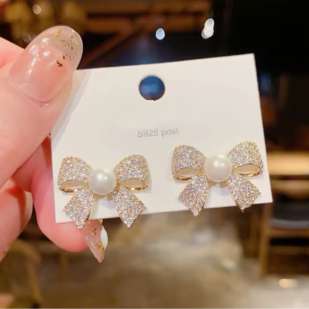 Gold and White Bow Stud Earrings